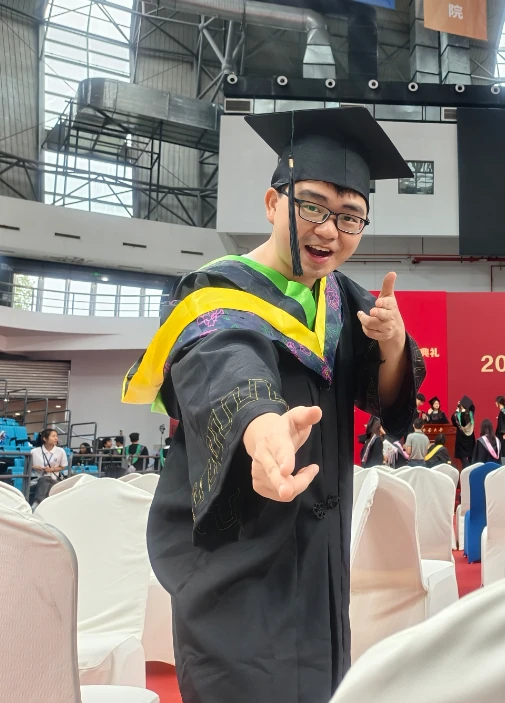 Yuhong Wang at his graduation ceremony
